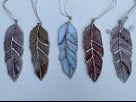 Handcrafted stained glass feather suncatchers with decorative solder, wirework and bead details by Christina’s Creations