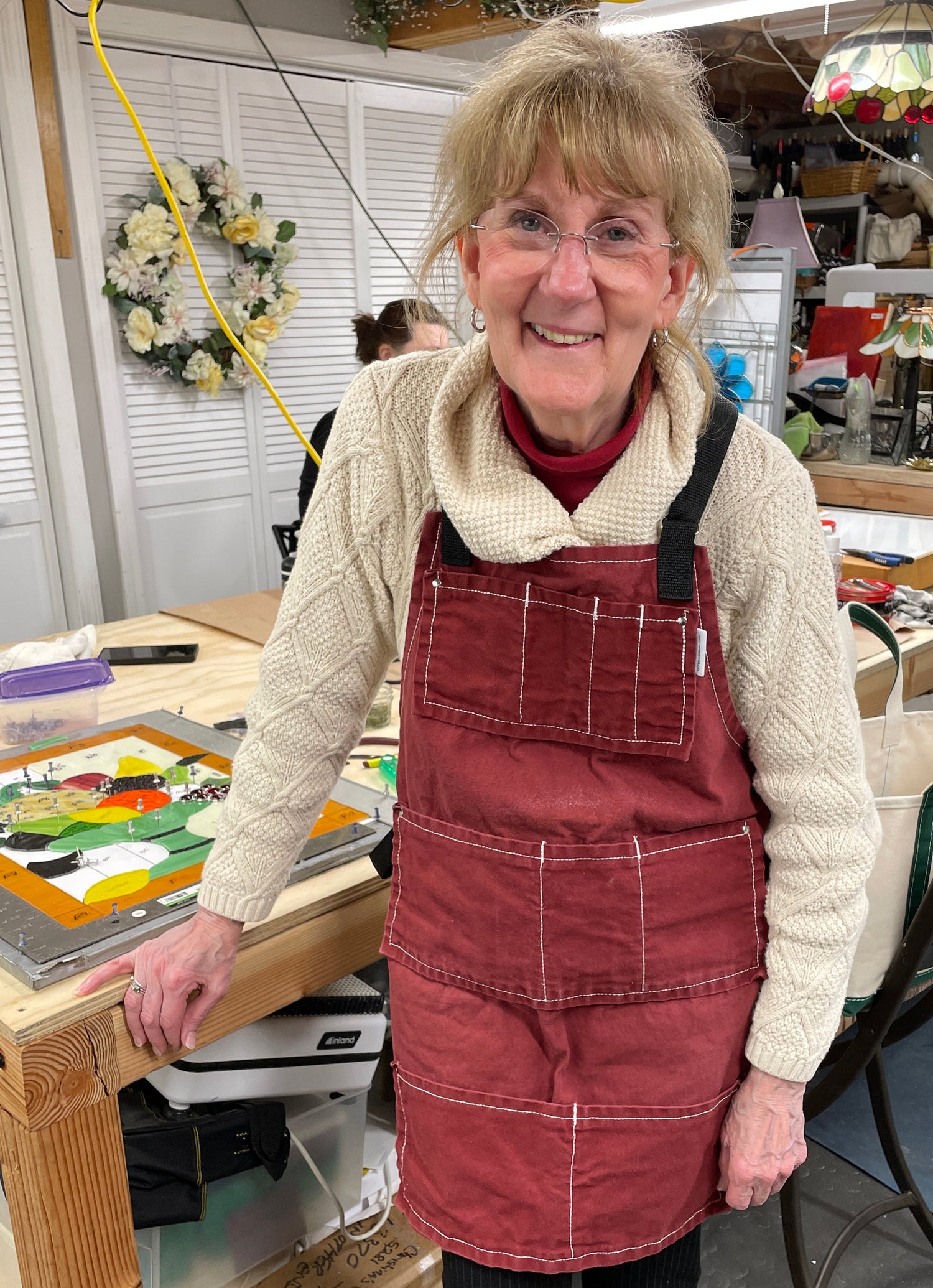 A stained glass student working during class at Christina’s Creations.